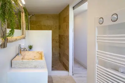 a bathroom with a sink and a shower at Résidence de Porticcio youyoube2 in Porticcio