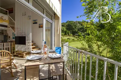 a table on the balcony of a house at Résidence de Porticcio youyoube2 in Porticcio