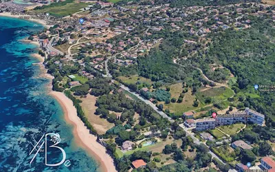 an aerial view of a beach and the ocean at Résidence de Porticcio youyoube2 in Porticcio