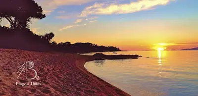 a drawing of a person sitting on the beach at sunset at Résidence de Porticcio youyoube2 in Porticcio