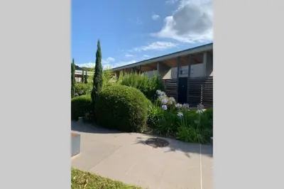 a house with a garden in front of it at Résidence Costa Nera Santa Giulia in Porto-Vecchio