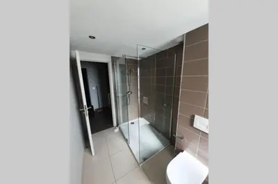 a bathroom with a shower and a toilet at Résidence Costa Nera Santa Giulia in Porto-Vecchio