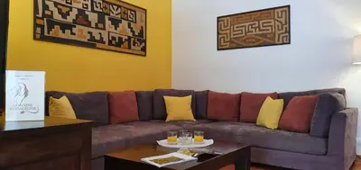 a living room with a couch and a table at Domaine Codaleone in Serriera