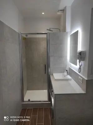 a bathroom with a shower and a sink at BRILOC AJACCIO centre ville in Ajaccio