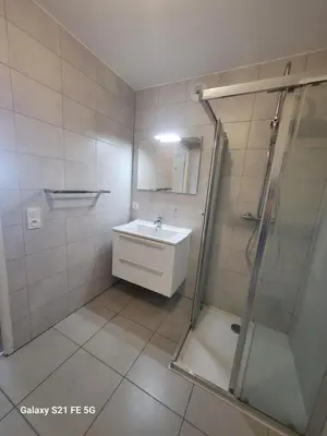 a bathroom with a sink and a shower at T2 VUE MER - ENTREE DE VILLE in Ajaccio