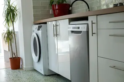 a white laundry room with a washer and dryer at CASA MONICA CARGESE - Swing 42 - appartement in Cargèse