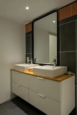a bathroom with a white sink and a mirror at CASA MONICA CARGESE - Swing 42 - appartement in Cargèse