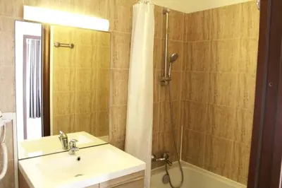 a bathroom with a sink and a shower and a tub at CosySeaside Corsica Ajaccio Piscine Terrasse Mer in Ajaccio