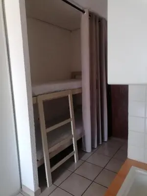 a small room with a bunk bed in it at Studio 4 personnes bord de mer avec piscine wifi in Cervione