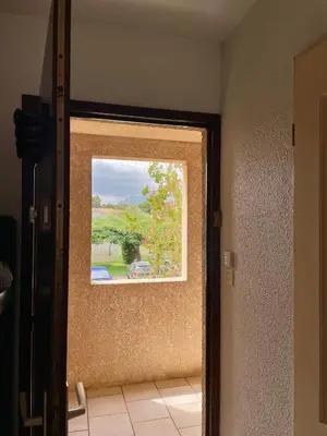 a door with a window in a room at Studio 4 personnes bord de mer avec piscine wifi in Cervione
