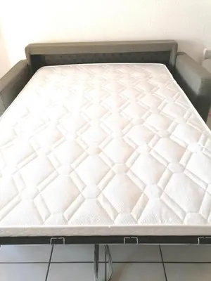 a mattress on a bed frame in a room at Studio 4 personnes bord de mer avec piscine wifi in Cervione