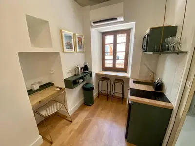 a small kitchen with a sink and a counter at Studio d'architecte centre historique in Ajaccio