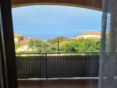 a window with a view of the ocean at Les Terrasses de Sari in Sari Solenzara