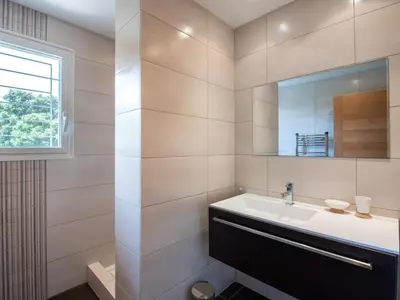 a bathroom with a sink and a mirror at Apartment Côté Plage by Interhome in Sainte-Lucie de Porto-Vecchio