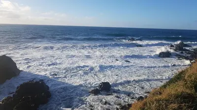 a view of the ocean with rocks and water at AJACCIO SANGUINAIRES APPT 3P POUR 4 A 5 P TTES COMMODITÉS TT CONFORT A 300M DE LA MER ET A 5 MN DU CENTRE VILLE in Ajaccio