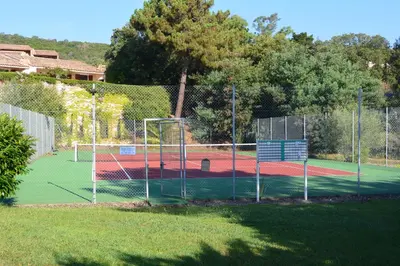 a tennis court with a tennis court at ORO 61 in Conca
