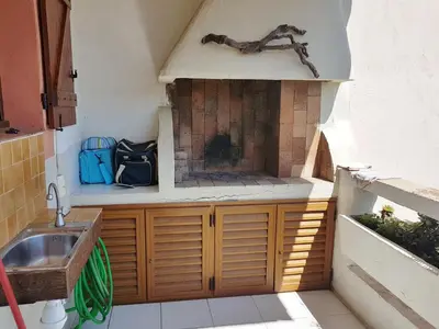 a small kitchen with a sink and a stove at ORO 61 in Conca