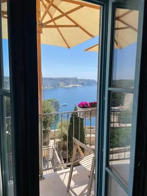 a view of the ocean from a balcony at Entre Ciel et Mer hotel in Bonifacio