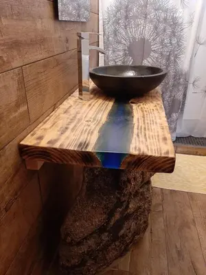 a bathroom with a black sink on a wooden table at Mini Villa Giuseppina in Bonifacio
