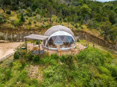 an aerial view of a domed building in a field at Domaine de Sonia - Logements éco-insolites in Porto-Vecchio