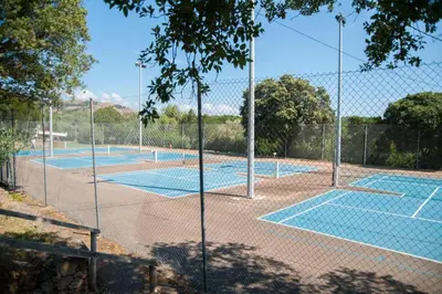 a row of tennis courts on a tennis court at Domaine de Sonia - Logements éco-insolites in Porto-Vecchio
