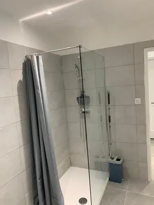 a shower with a glass door in a bathroom at Au cœur de sartene in Sartène