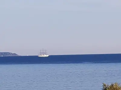 a boat in the middle of a large body of water at VIEILLE VILLE D AJACCIO de 1 a 4 PERs A 300M DU PORT ET A 15 MN DE LAEROPORT PROCHES DE PLUS BELLES PLAGES ET TTES COMMODITES A PROXIMITE in Ajaccio