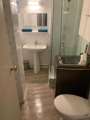 a bathroom with a toilet and a sink at VIEILLE VILLE D AJACCIO de 1 a 4 PERs A 300M DU PORT ET A 15 MN DE LAEROPORT PROCHES DE PLUS BELLES PLAGES ET TTES COMMODITES A PROXIMITE in Ajaccio
