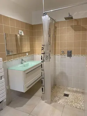 a bathroom with a bath tub and a shower at Maison vue mer Propriano Viggianello in Viggianello