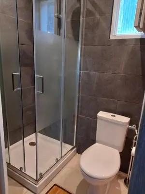 a bathroom with a toilet and a shower at Maisonnette U Santu Ghjuvandria ou A Santa Ghjulia entre mer et Montagne in Volpajola