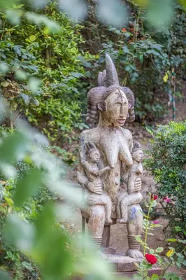 a stone statue of a woman with two children at U Tempu Persu in Grosseto-Prugna