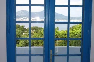an open window looking out at a view of the water at Villa vue sur mer Corse Blanca Casa à PORTICCIO AJACCIO in Grosseto-Prugna