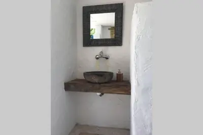 a bathroom with a sink and a mirror at Villa vue sur mer Corse Blanca Casa à PORTICCIO AJACCIO in Grosseto-Prugna