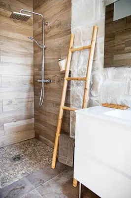a ladder in a bathroom with a shower at Villa Bianca in Zonza