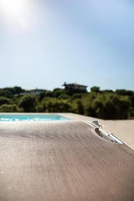 a close up of a hammock on a beach at Villa Bianca in Zonza