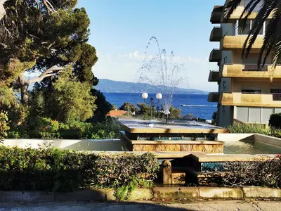 a view of the ocean from a building at Appartement Ajaccio Sanguinaires in Ajaccio