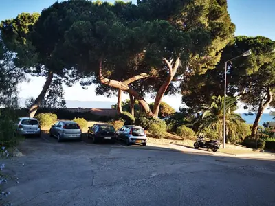 a group of cars parked in a parking lot at Appartement Ajaccio Sanguinaires in Ajaccio