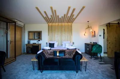 a bedroom with a bed and a couch at 