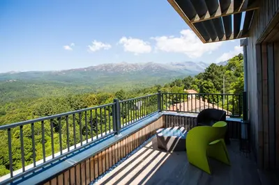 a balcony with a view of the mountains at 