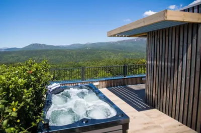 a hot tub on the deck of a house at 