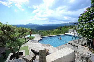 a swimming pool with a view of the mountains at 