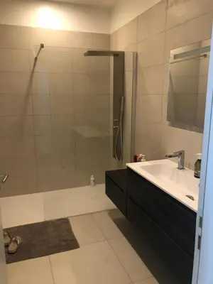 a bathroom with a shower and a tub and a sink at Ajaccio appartement 4 couchages, climatisé a 150m de la plage route des sanguinaires, parking privé in Ajaccio