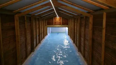 a long room with water inside of a building at Appartement vue mer en Résidence avec piscine in Porto-Vecchio