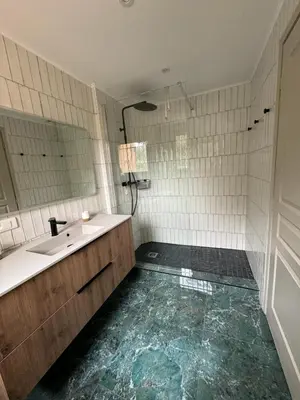 a bathroom with a sink and a mirror at Appartement vue mer en Résidence avec piscine in Porto-Vecchio