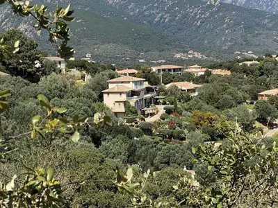 a house in the middle of a forest of trees at Appartement vue mer en Résidence avec piscine in Porto-Vecchio