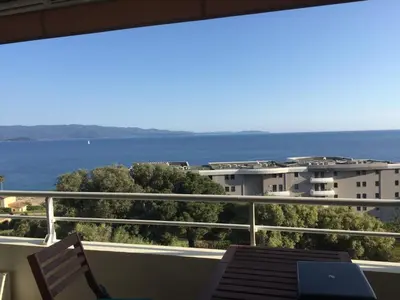 a balcony with a view of the ocean at Appartement T3 classé 3 étoiles vue mer avec terrasse ,plage 2 minutes à pied in Ajaccio