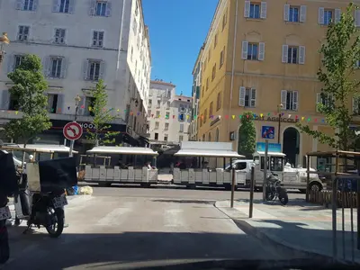 a city with buildings and a street with a motorcycle at AJACCIO CATHEDRALE AU COEUR DE LA CITEE IMPERIALE POUR 3 a 4 PERS PROCHE DES PLUS BELLES PLAGES ET DE TOUTES COMMODITES PORT A 2MN in Ajaccio