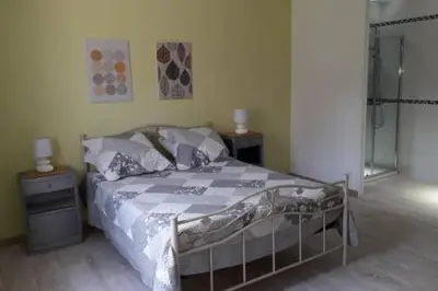 a bedroom with a bed and two night stands at Gites Albareddu Conca in Conca