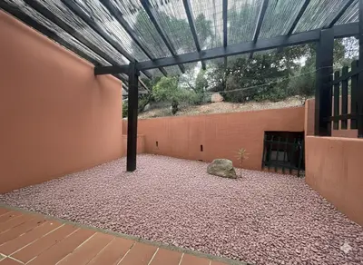 a building with a glass roof and a rock at 8 ARBOUSIERS VILLA 21 in Bonifacio