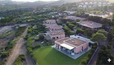 an aerial view of a large house with a yard at 8 ARBOUSIERS VILLA 20 in Bonifacio
